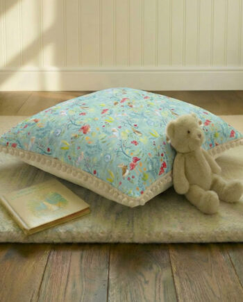 A large personalised floor cushion for children, designed for comfort and cosy play. Made from premium cotton fabrics, with a soft padded inner and a warm cream backing as standard. Available in a range of designs from the Tales of the Rabbit collection, with the option to add pom-pom trim for a beautiful finishing touch. Perfect for reading corners, teepee styling, and calm, cosy spaces.