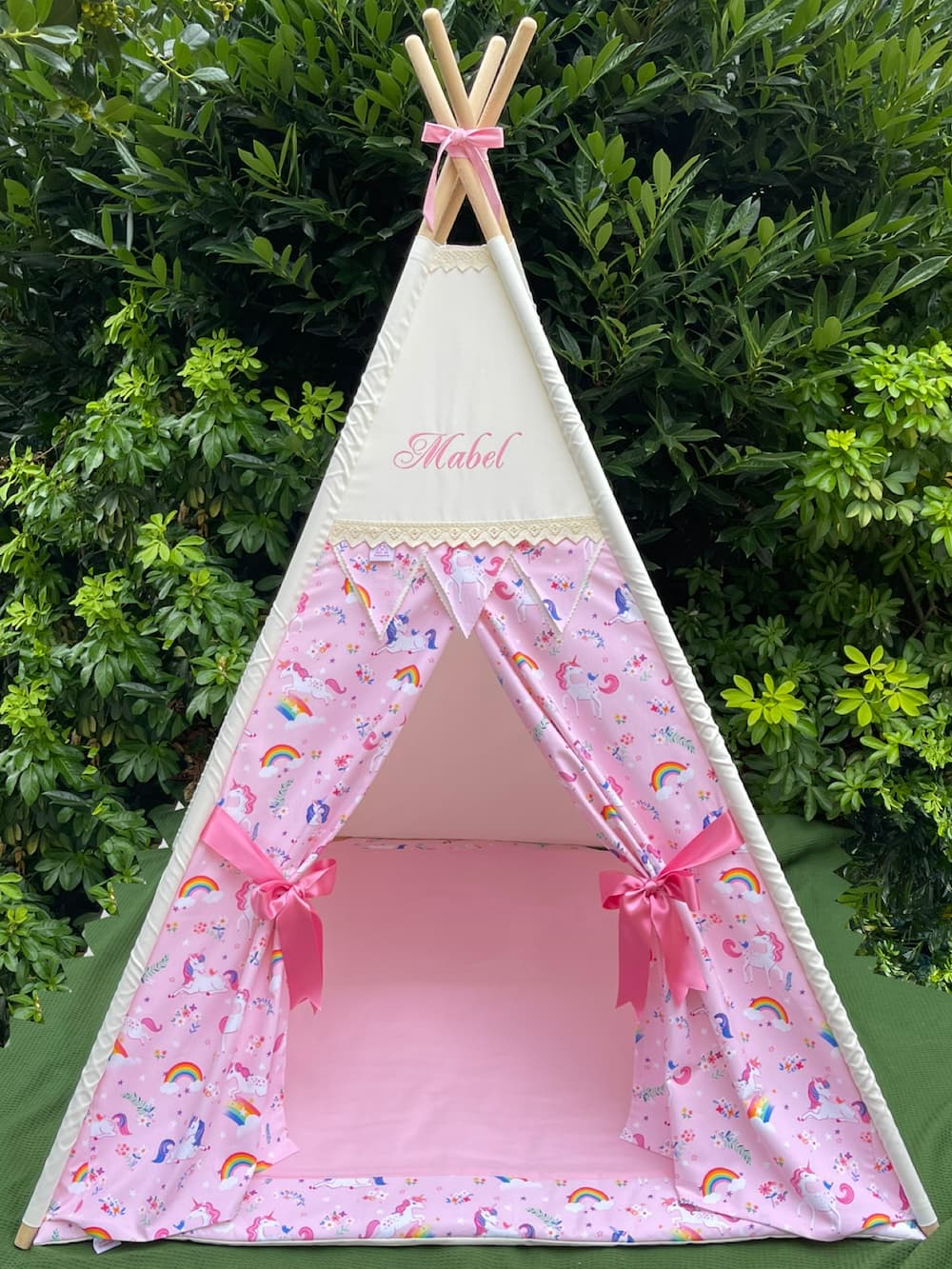 Front view of personalised pink unicorn kids teepee tent with curtains tied open